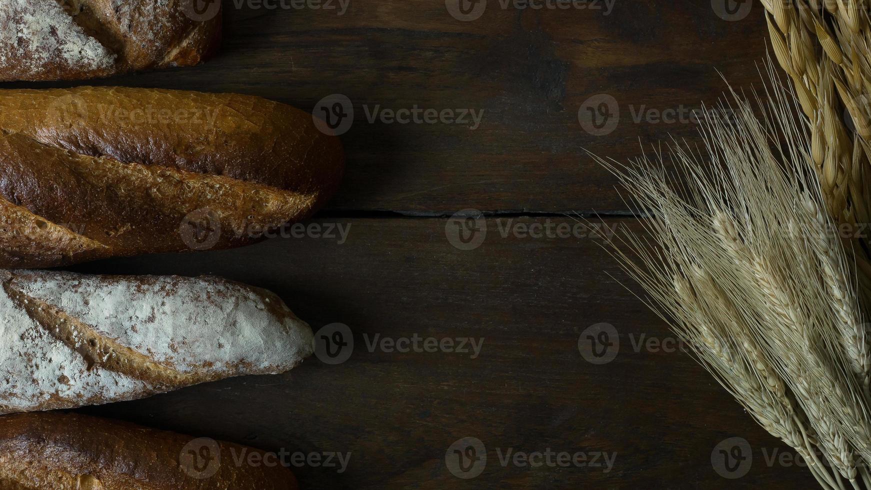 Bread  Wheat oats on wood  image background. photo