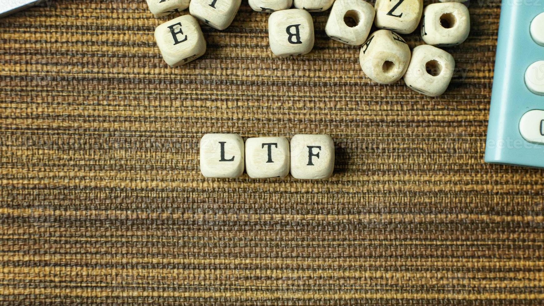 Text LTF on wooden cube image  for business content. photo
