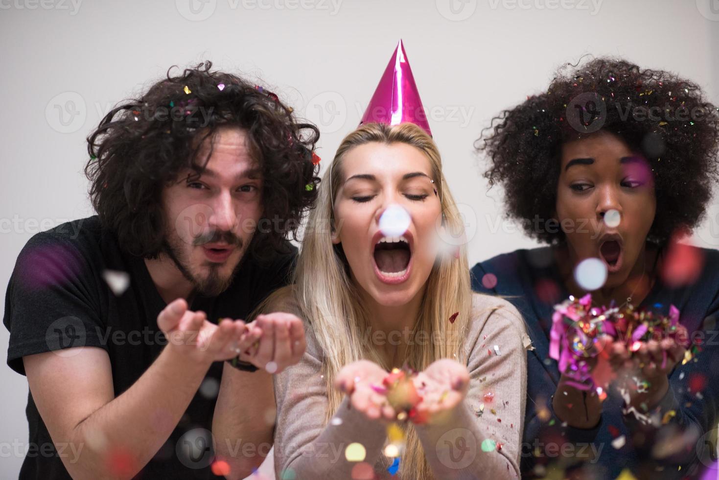 confetti party multiethnic group of people photo