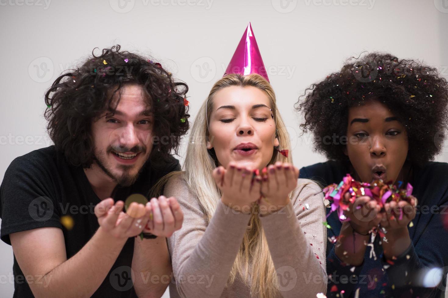 confetti party multiethnic group of people photo