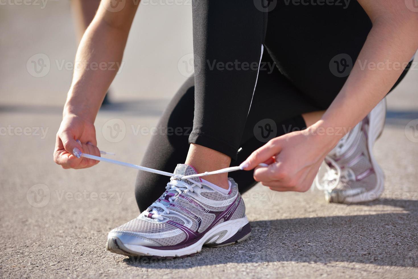 Couple doing stretching exercise  after jogging photo