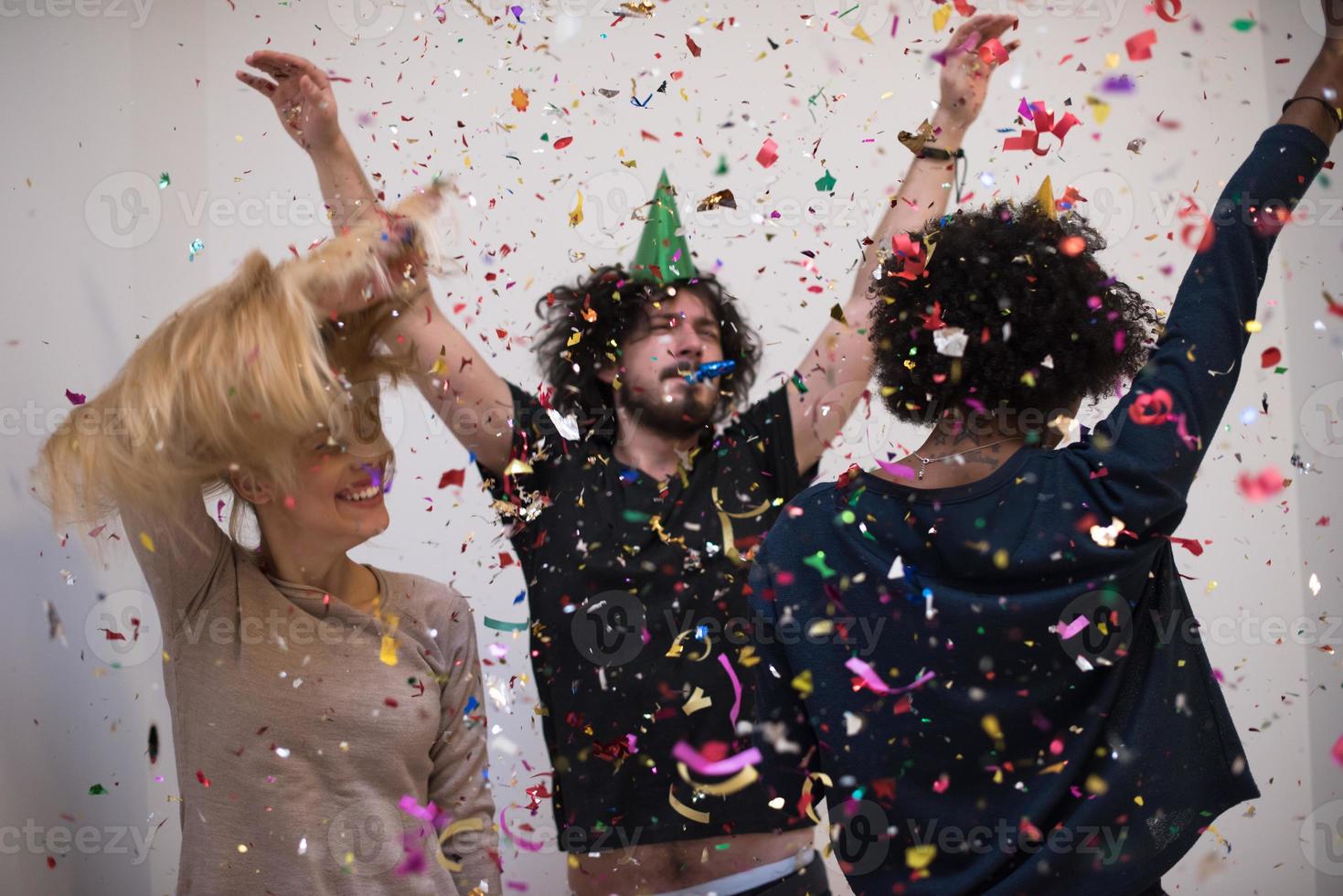 confetti party multiethnic group of people photo