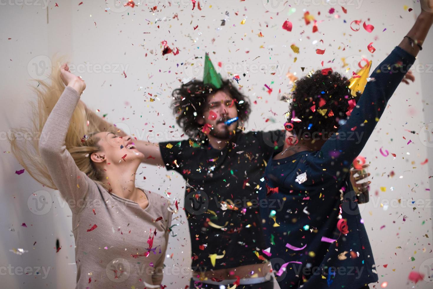 confetti party multiethnic group of people photo