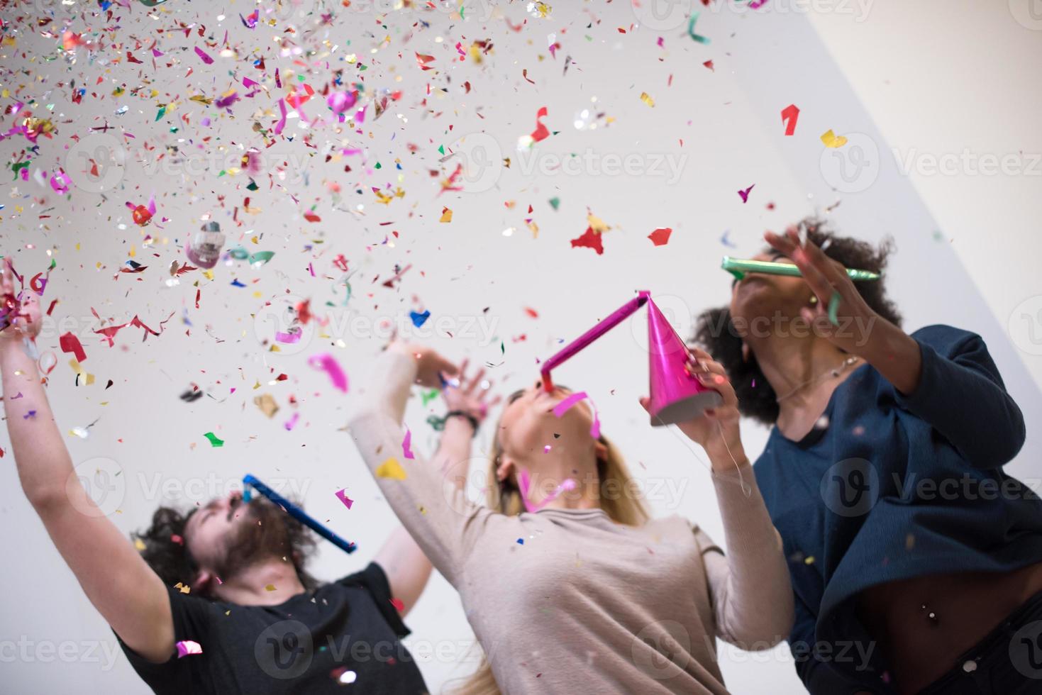 confetti party multiethnic group of people photo