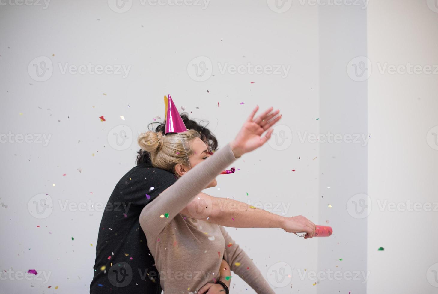 romantic young  couple celebrating  party with confetti photo