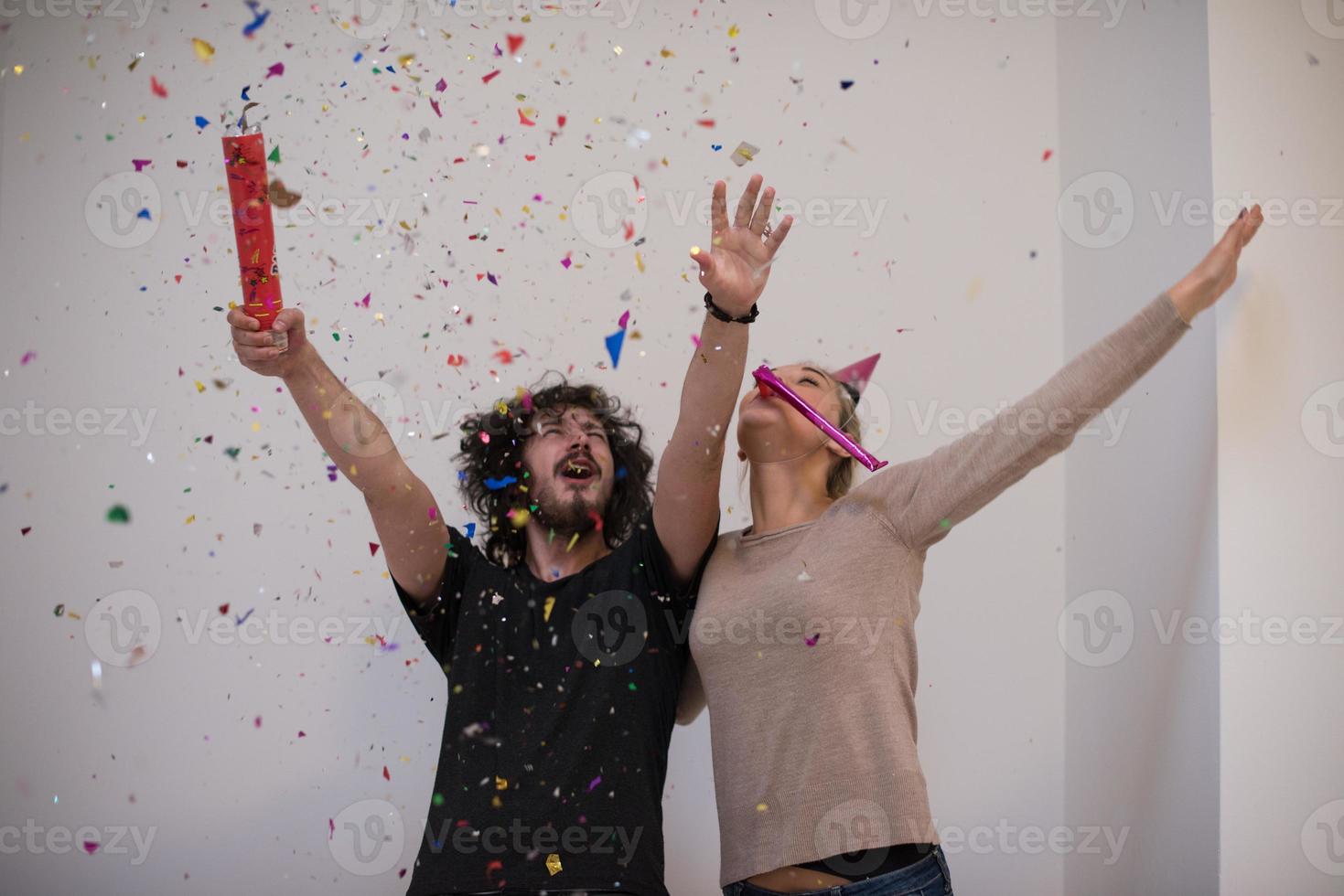 romantic young  couple celebrating  party with confetti photo