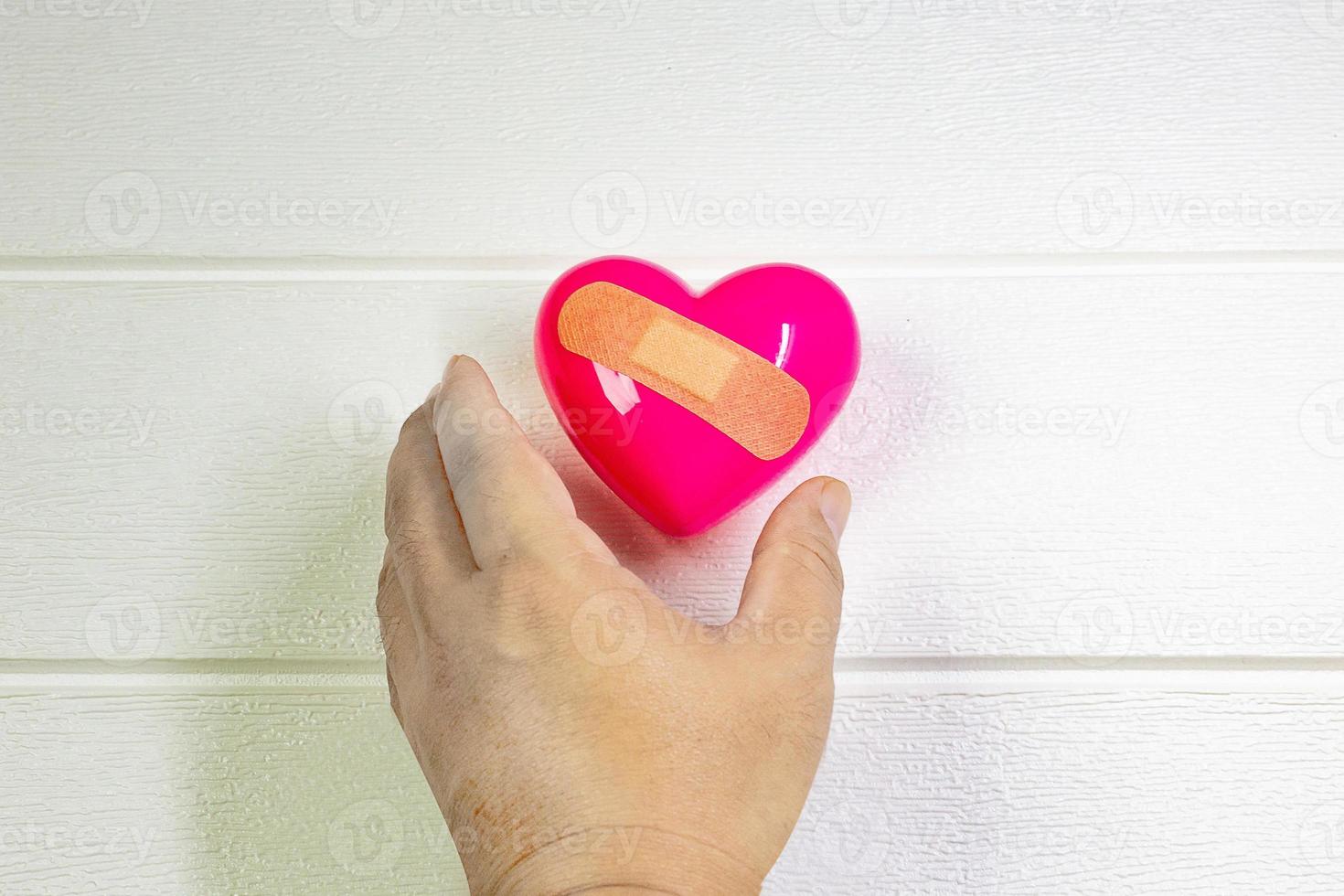 pink Heart and hand for medical content. photo