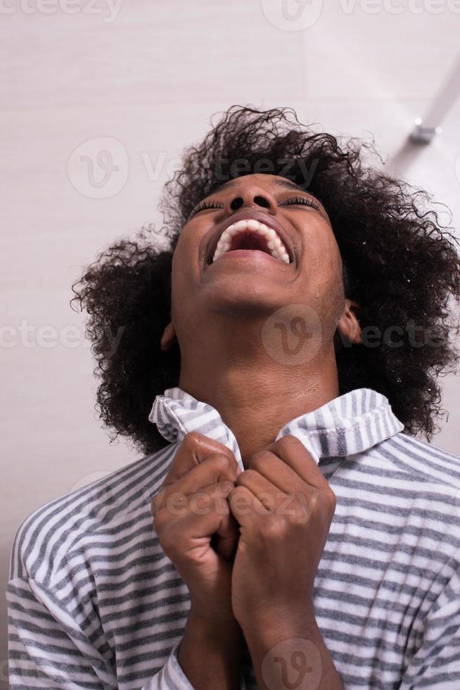 beautiful black woman wearing  bathrobe photo