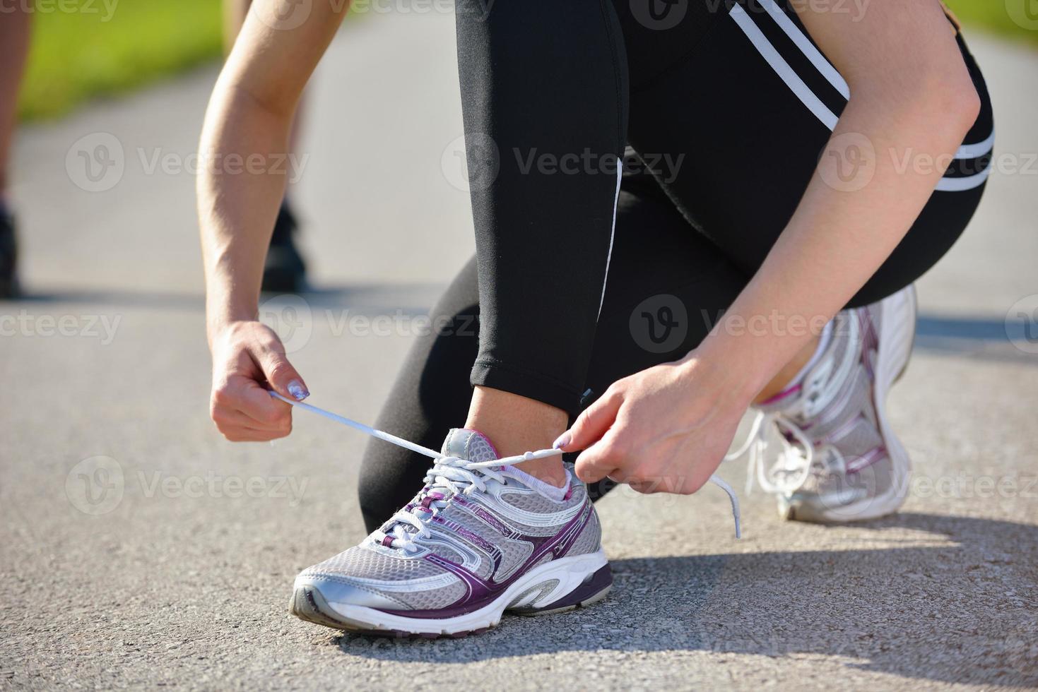 Young beautiful  woman jogging at morning in park photo