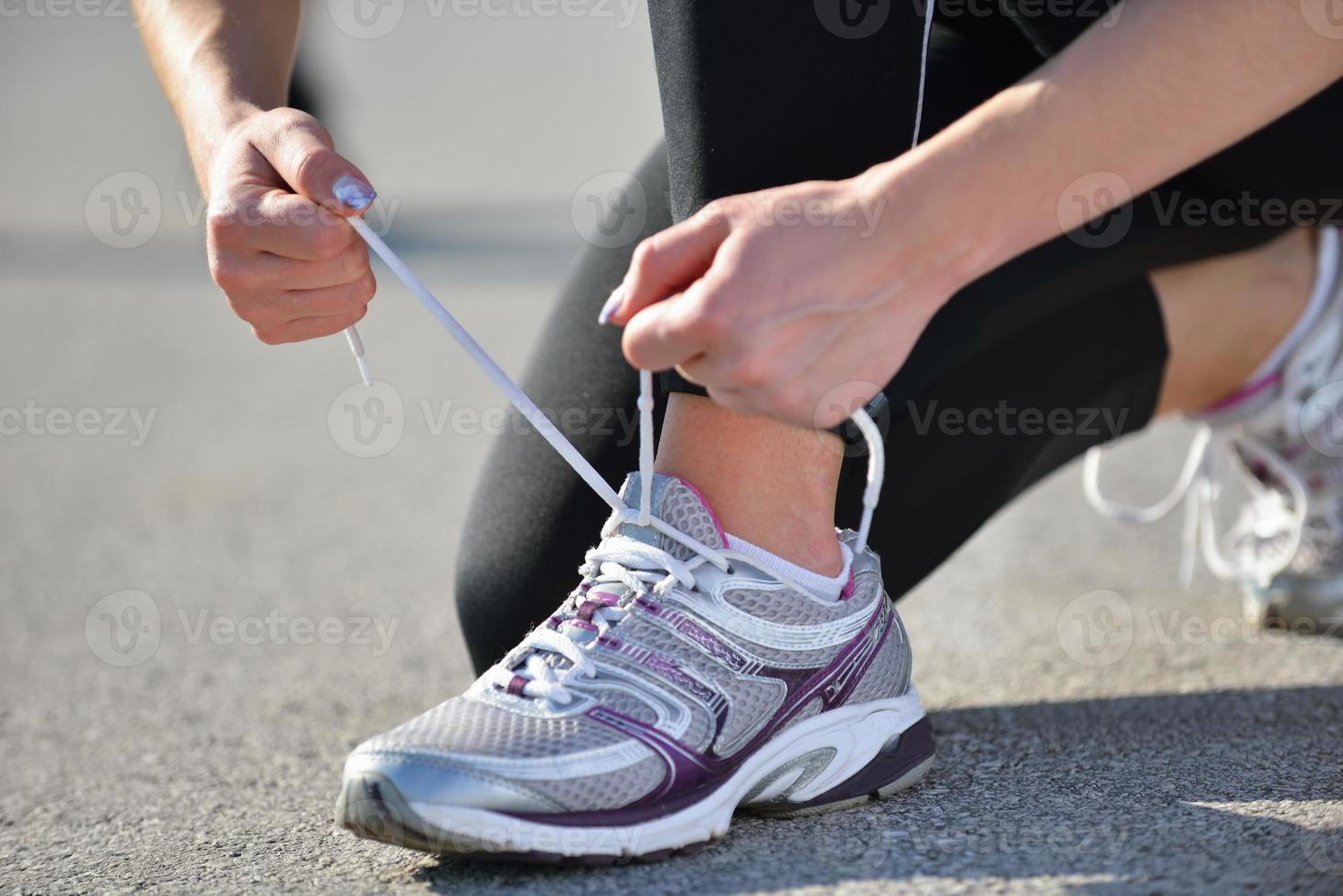 Young beautiful  woman jogging at morning in park photo