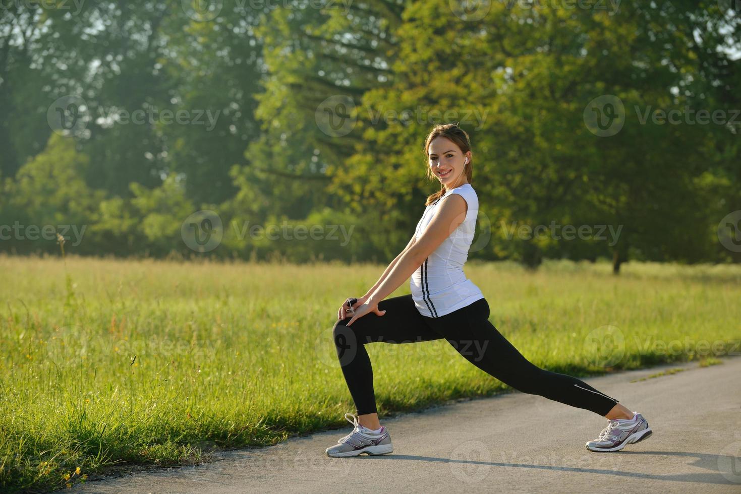 woman stretching before fitness photo