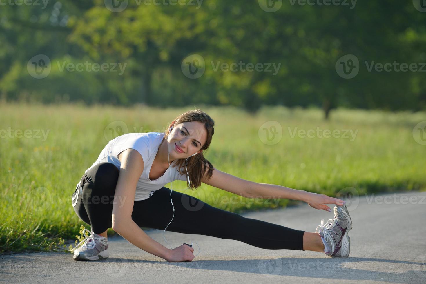 woman stretching before fitness photo