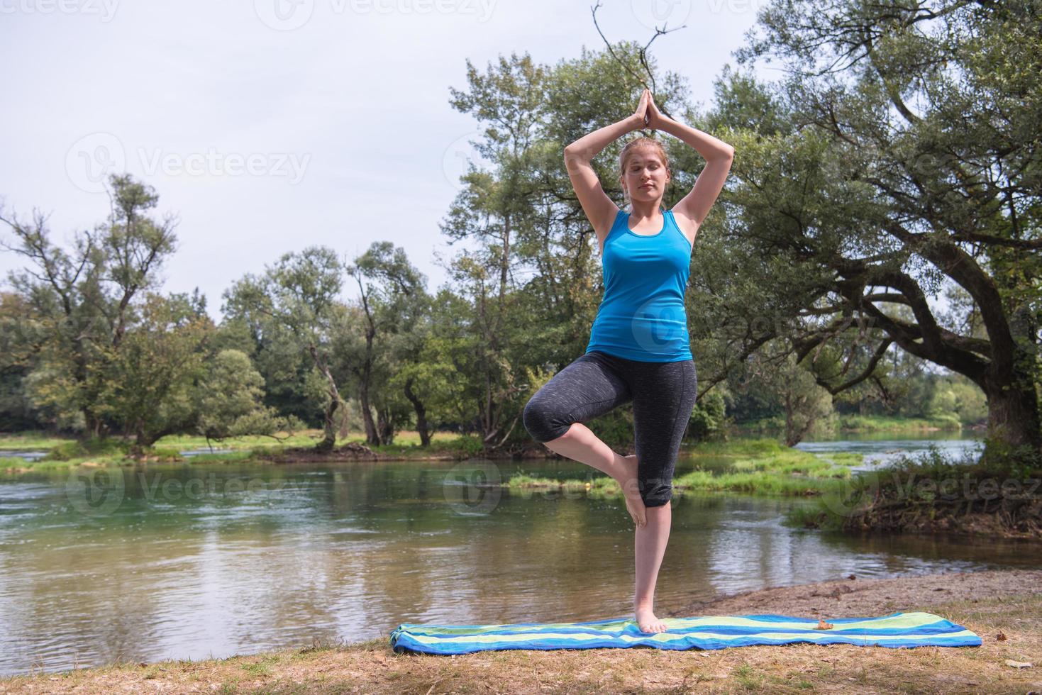 woman meditating and doing yoga exercise photo