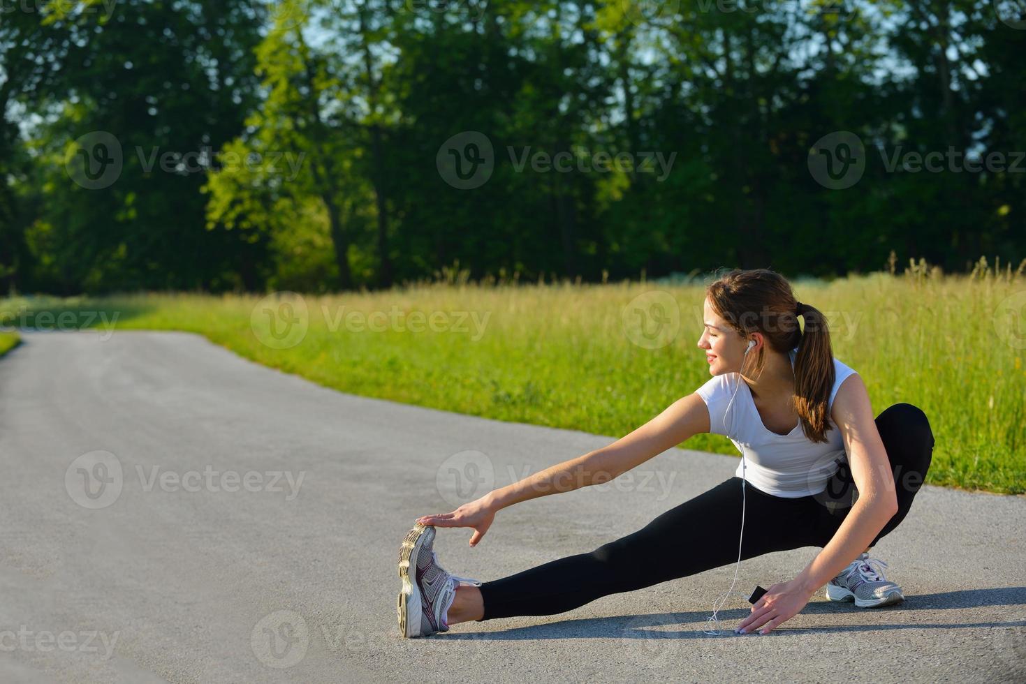 woman stretching before fitness photo