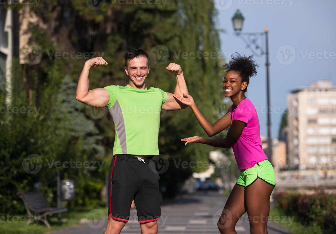 portrait of young multietnic jogging couple ready to run photo