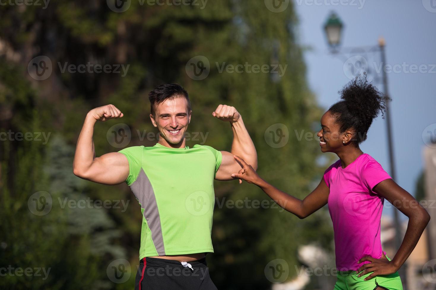 portrait of young multietnic jogging couple ready to run photo