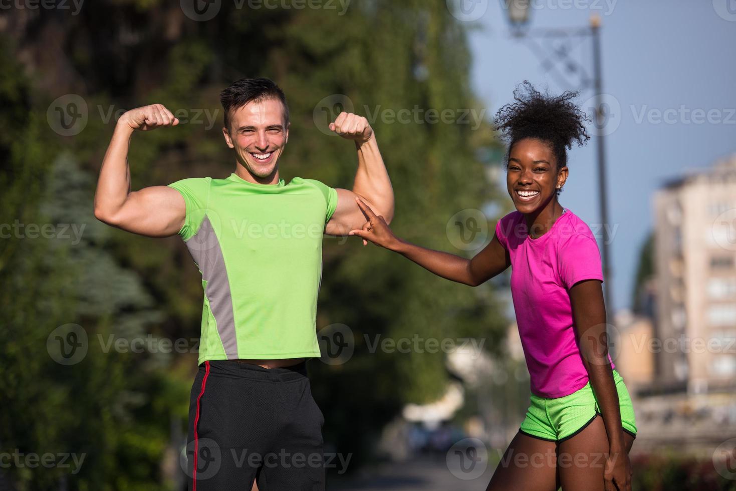 portrait of young multietnic jogging couple ready to run photo