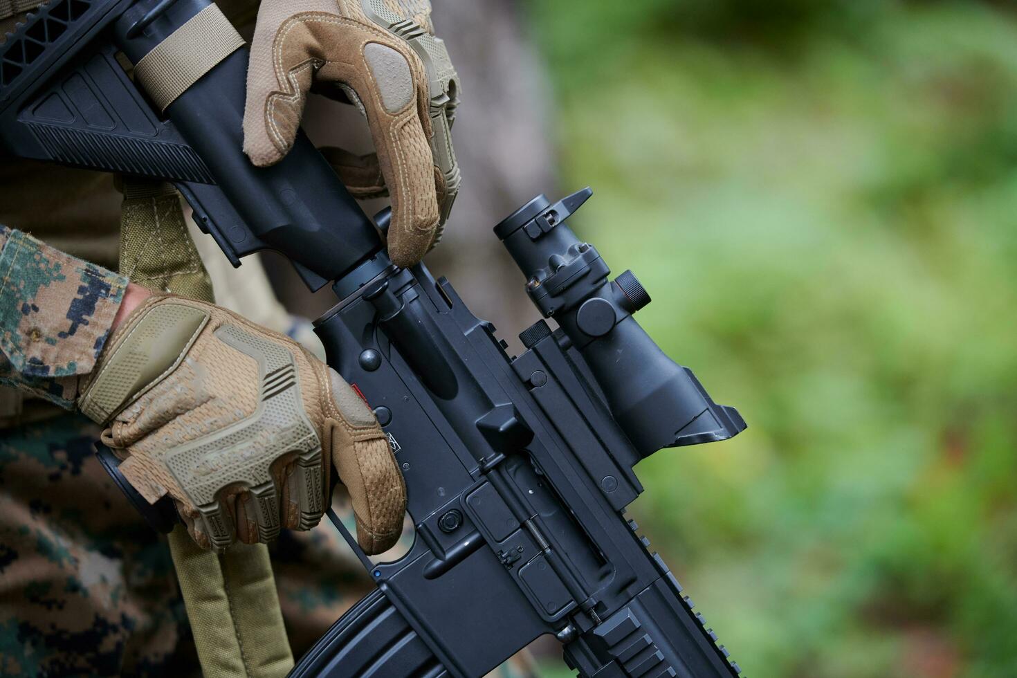 soldier preparing tactical and commpunication gear for action battle photo