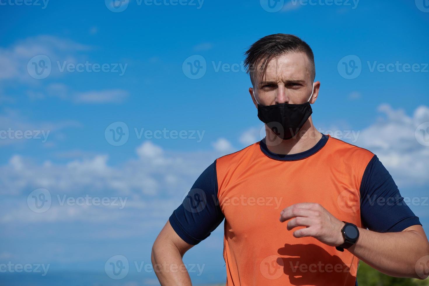 man with protective mask  relaxing after running photo