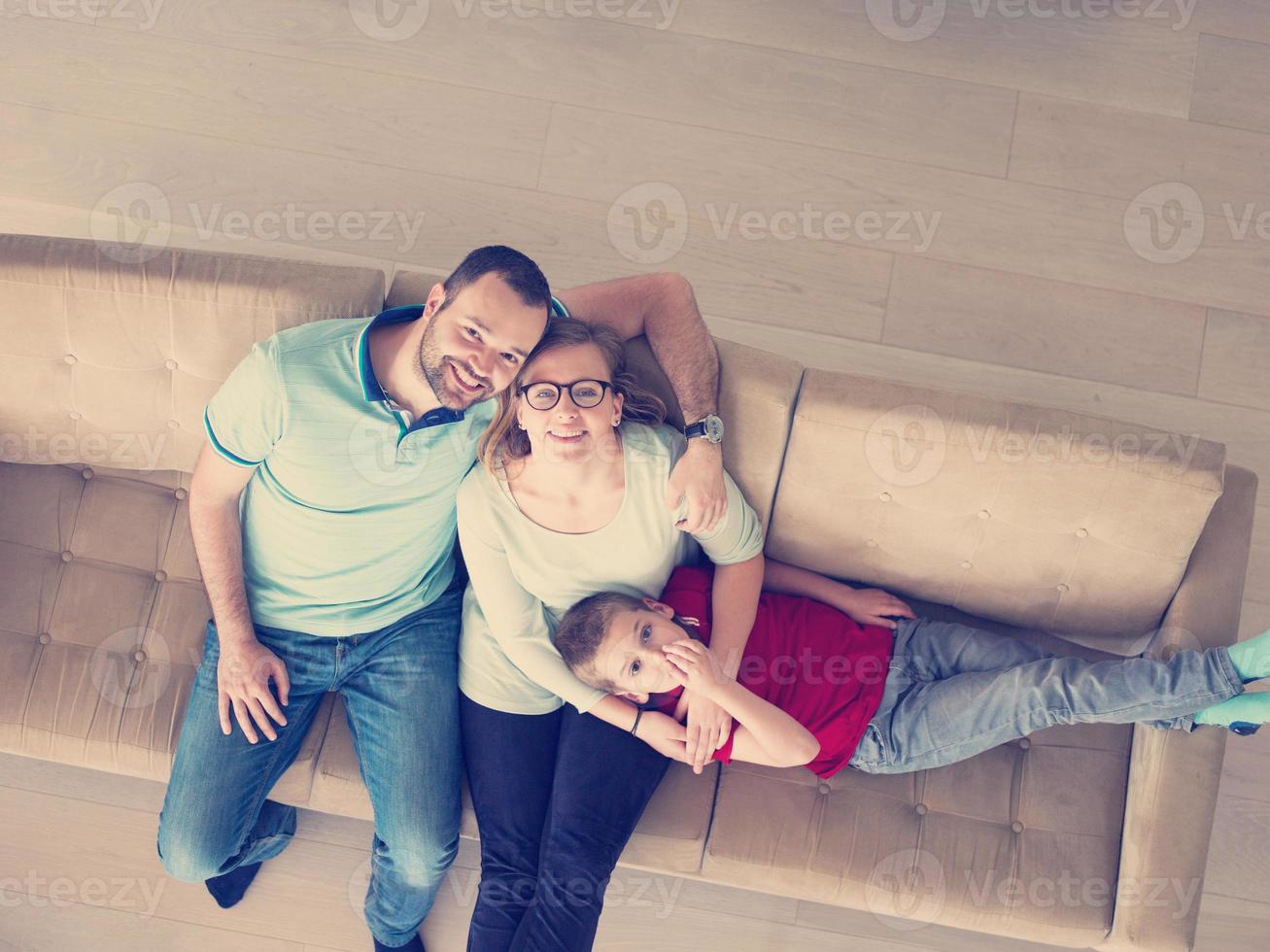 family with little boy enjoys in the modern living room photo