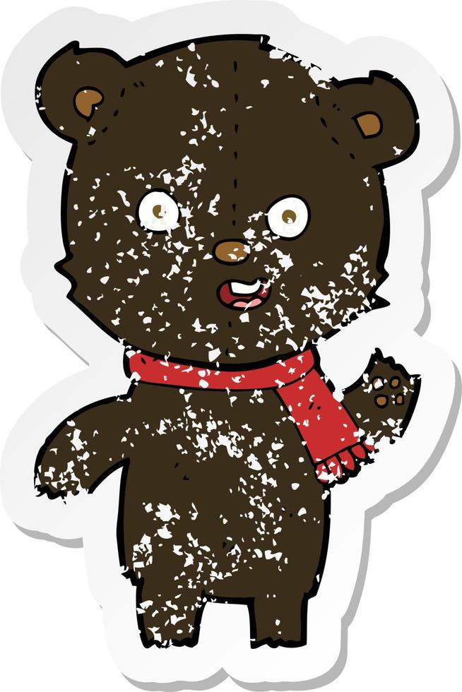 retro distressed sticker of a cartoon waving black bear cub with scarf vector