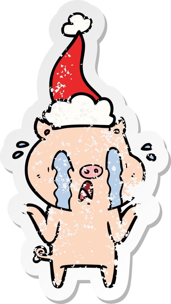 crying pig distressed sticker cartoon of a wearing santa hat vector