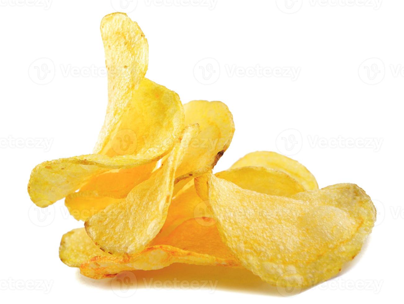 A bunch of potato chips are isolated on a white background. photo