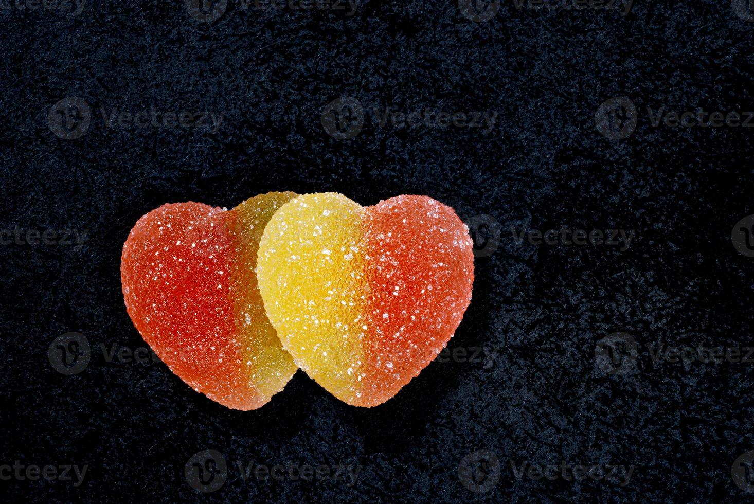Two heart-shaped candy. Marmalade candy in the form of a heart. photo