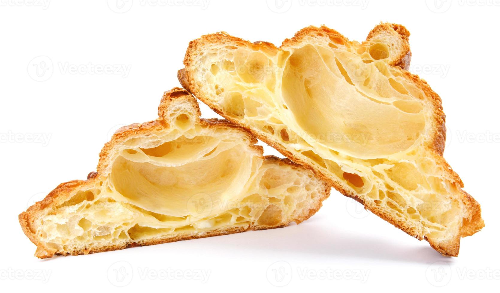 Sliced croissant isolated on white background. Fresh bakery . photo