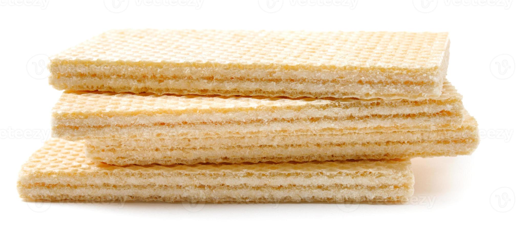 Several crisp waffles are isolated on a white background. photo