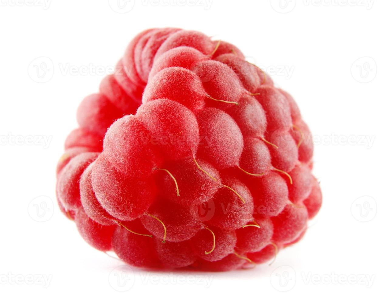 The beautiful ripe raspberry berry is isolated on a white background. Red raspberry. Full clipping path. photo