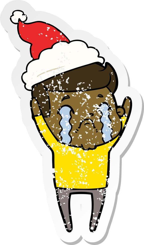 distressed sticker cartoon of a man crying wearing santa hat vector