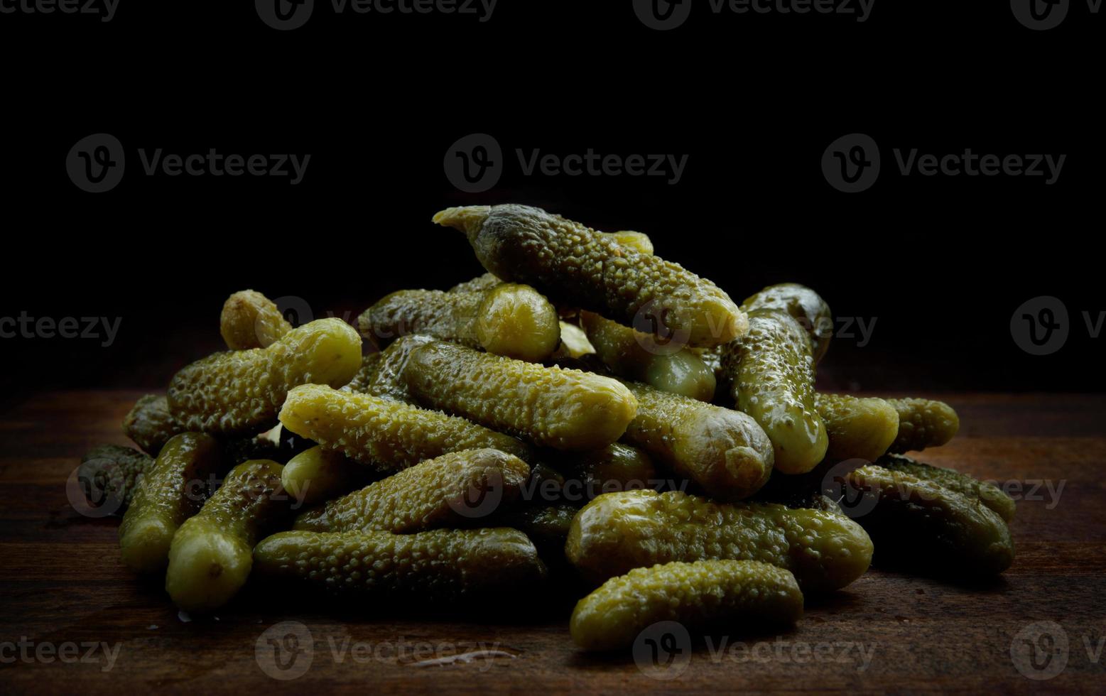 A slide of juicy crispy pickled cucumbers. Pickles. photo