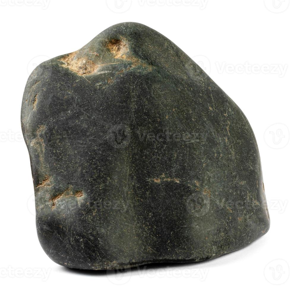 Black rolled stone is isolated on a white background. Full clipping path. photo