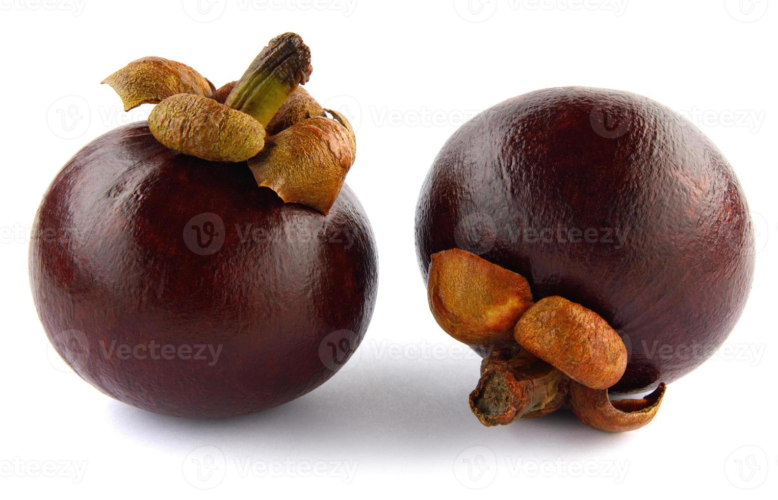 Two ripe mangosteen isolated on a white background. photo