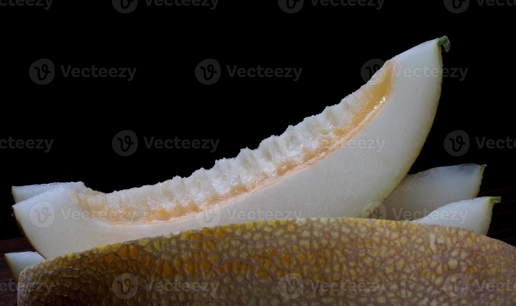 Slice of ripe melon and half melon. photo