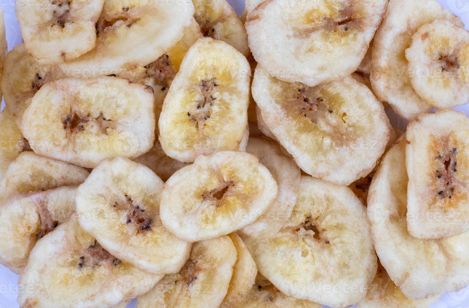 Background consisting of banana chips. Banana chips. photo