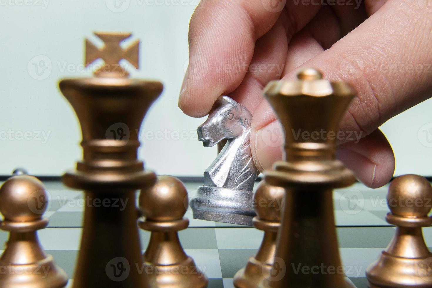 gold and silver chess on board close up image abstract Background. photo