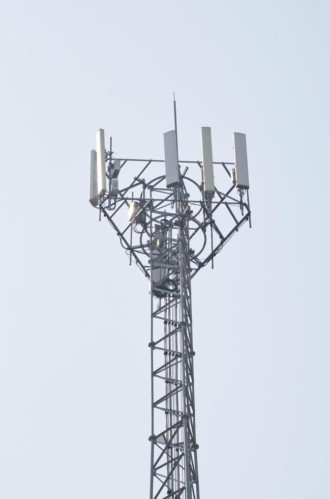Equipment and transmission towers on clean sky background. Telecommunication. photo