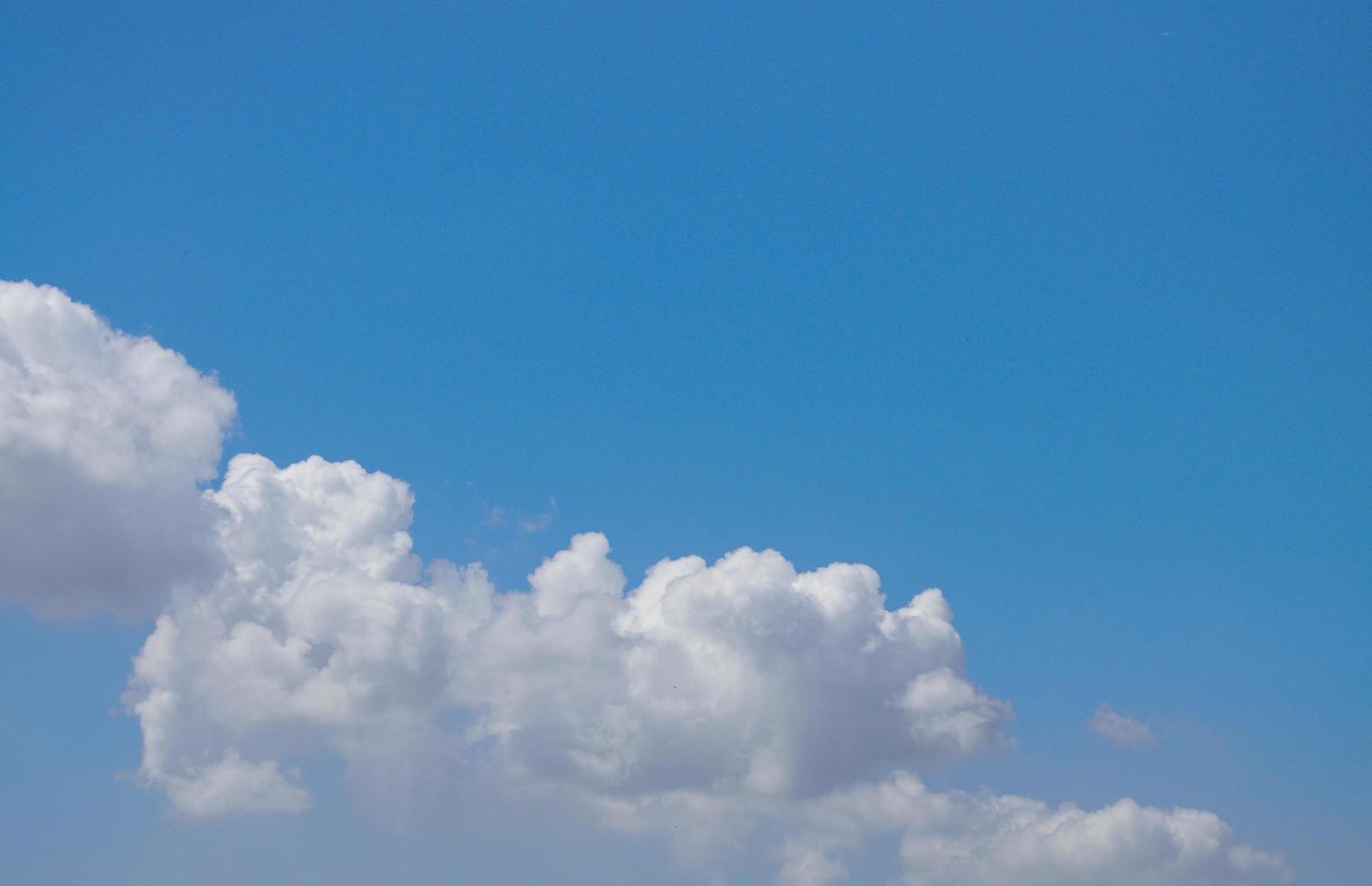 Blue sky background with tiny clouds background. photo