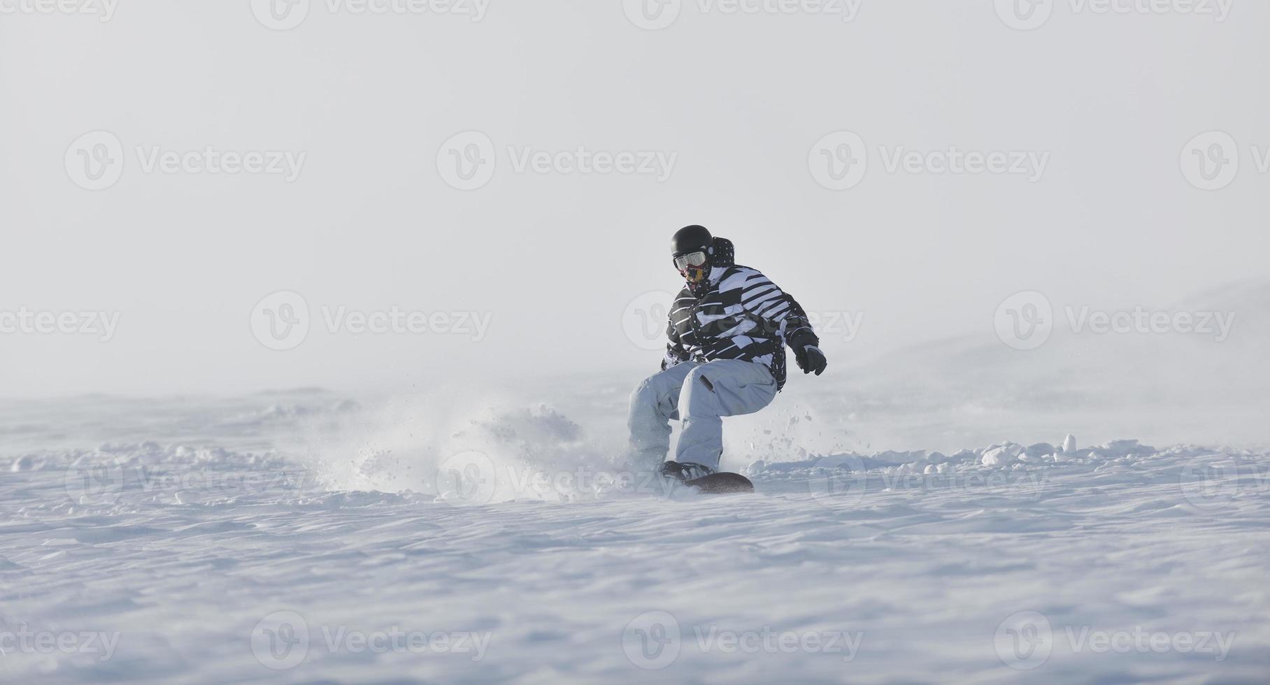 freestyle snowboarder jump and ride photo