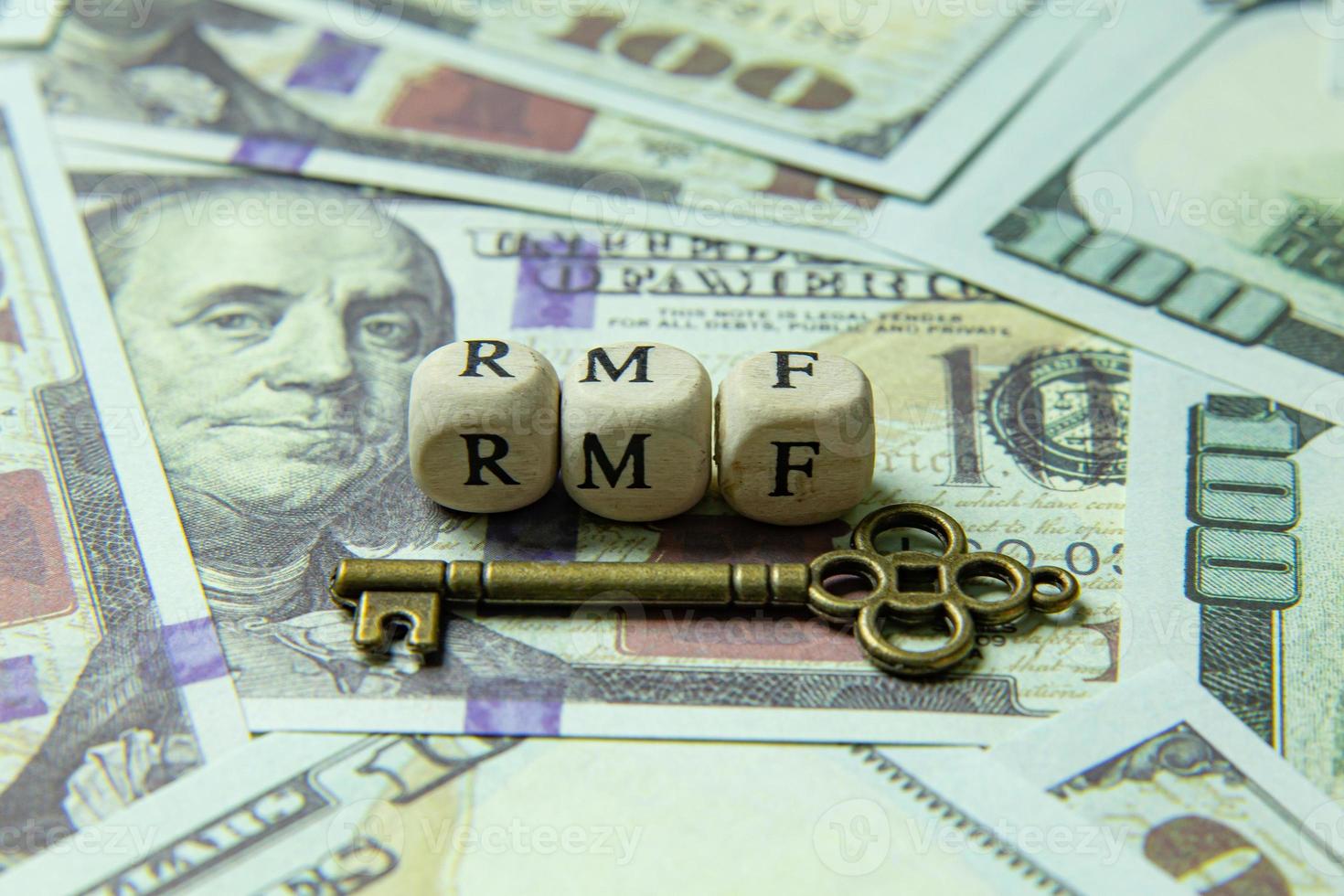 rmf wooden cube  and gold keyon banknotes for business content. photo