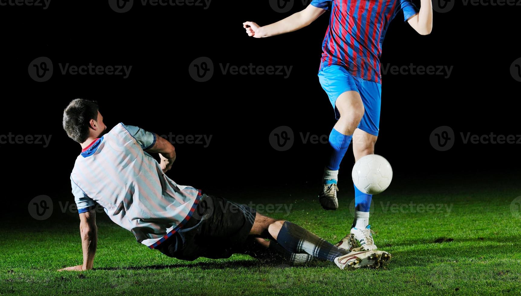 football players in competition for the ball photo