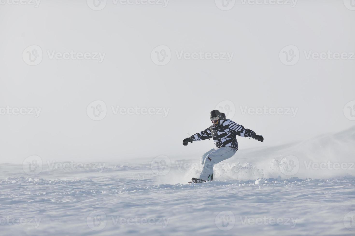 freestyle snowboarder jump and ride photo