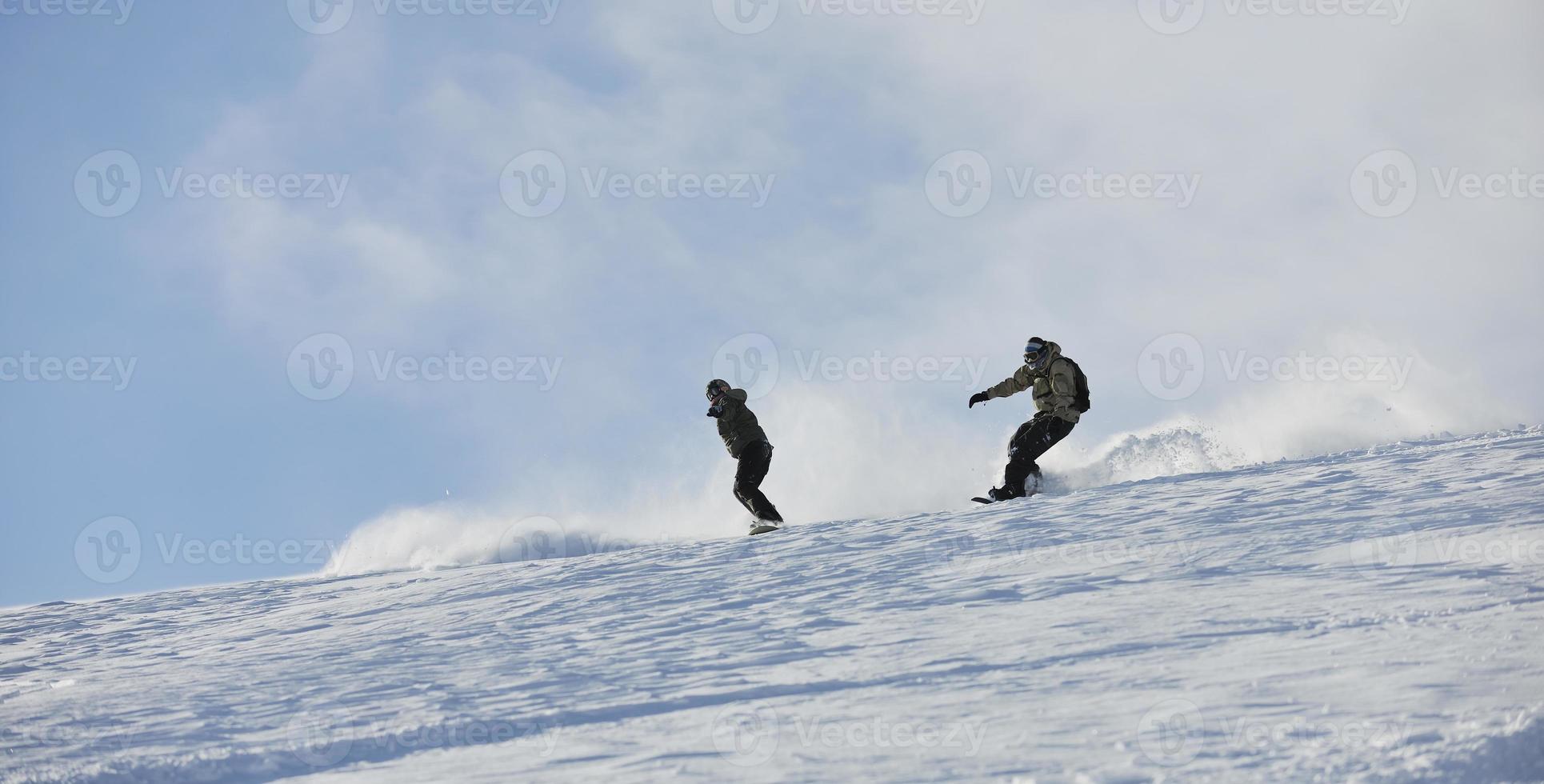 freestyle snowboarder jump and ride photo