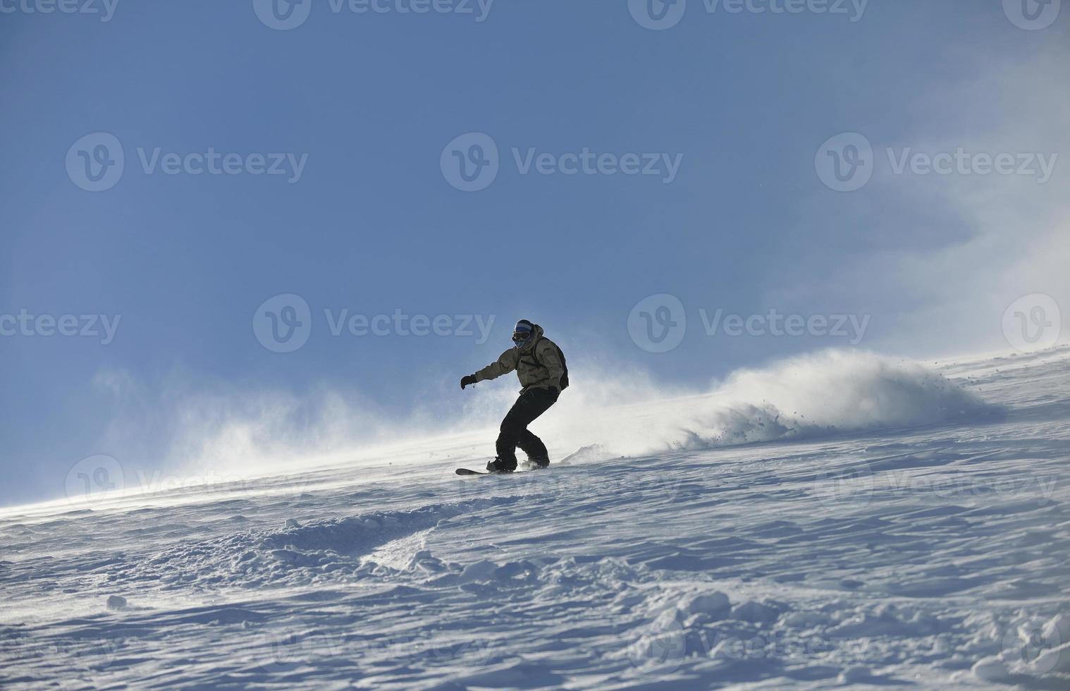 freestyle snowboarder jump and ride photo