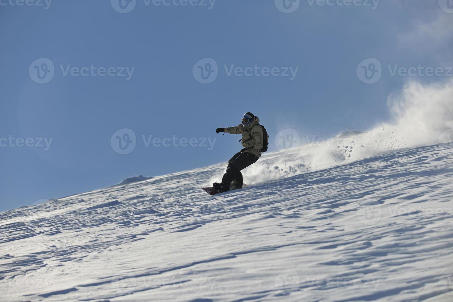 freestyle snowboarder jump and ride photo