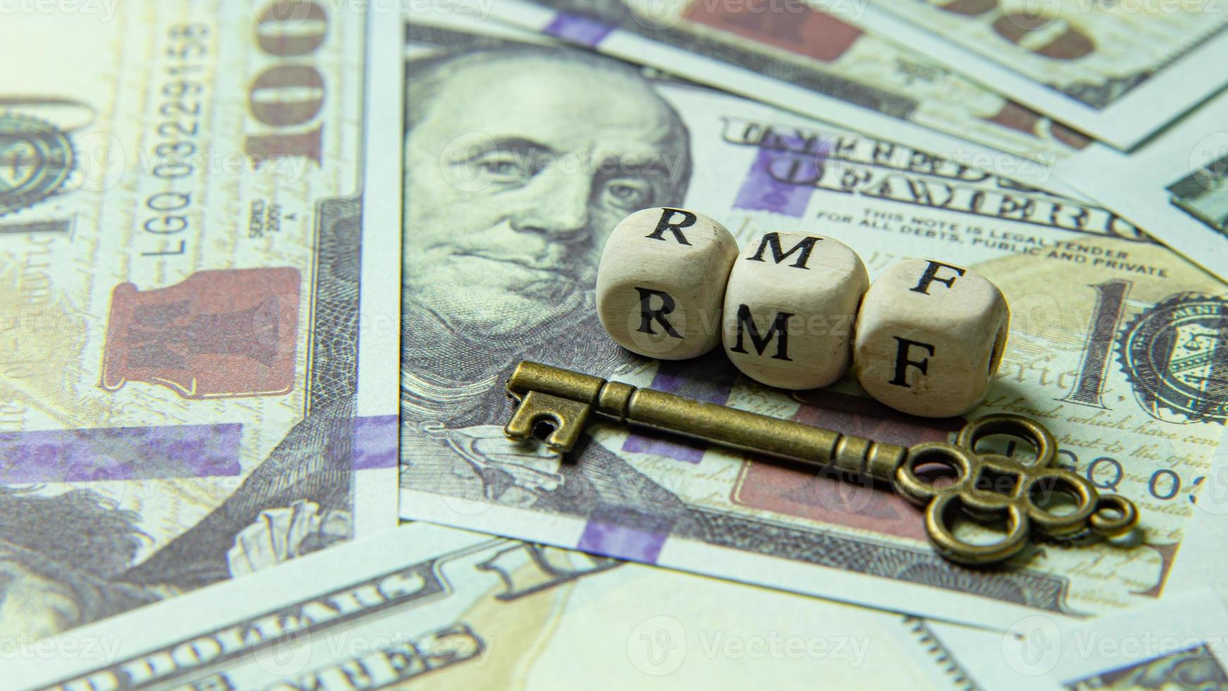 rmf wooden cube  and gold keyon banknotes for business content. photo