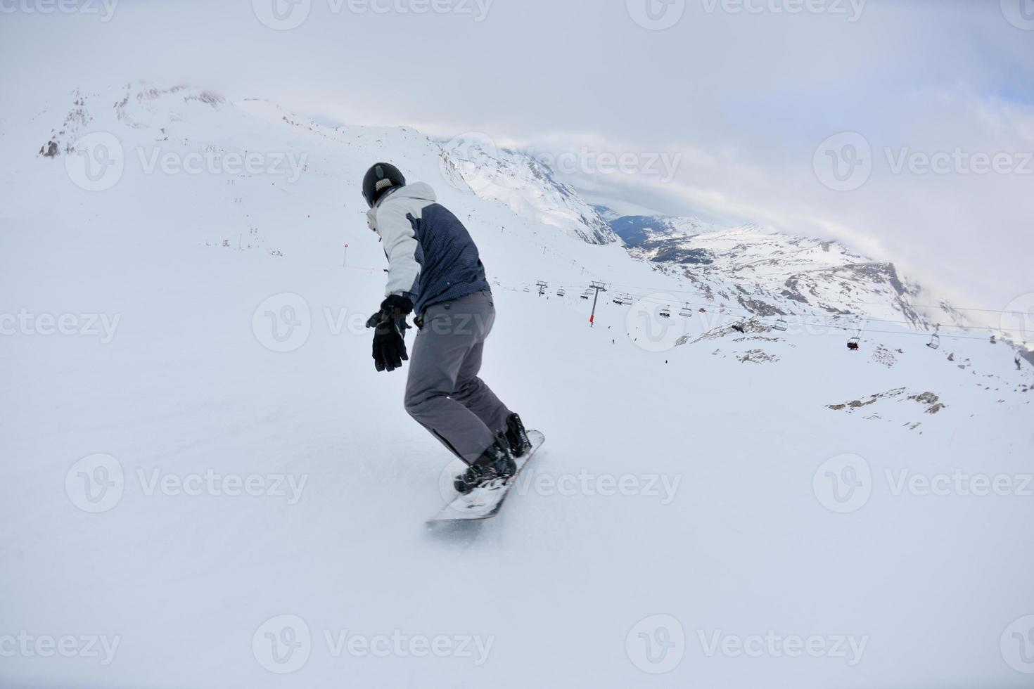 skiing on fresh snow at winter season at beautiful sunny day photo