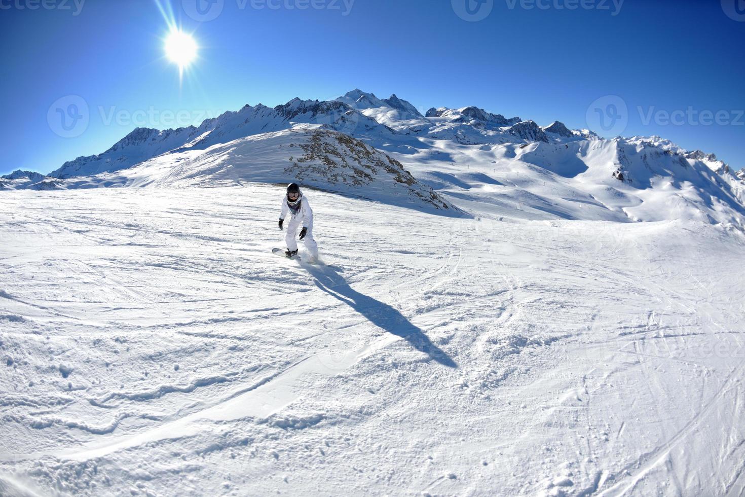 skiing on fresh snow at winter season at beautiful sunny day photo